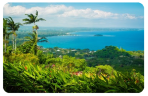 Beautiful Vanuatu with lush green hills, turquoise water, and blue skies